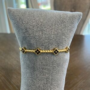 Elegant Gold and Navy Clover Bracelet